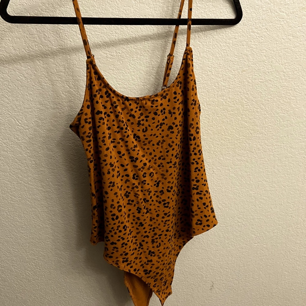 Cheetah print body suit, the back has the crisscross strings tie up